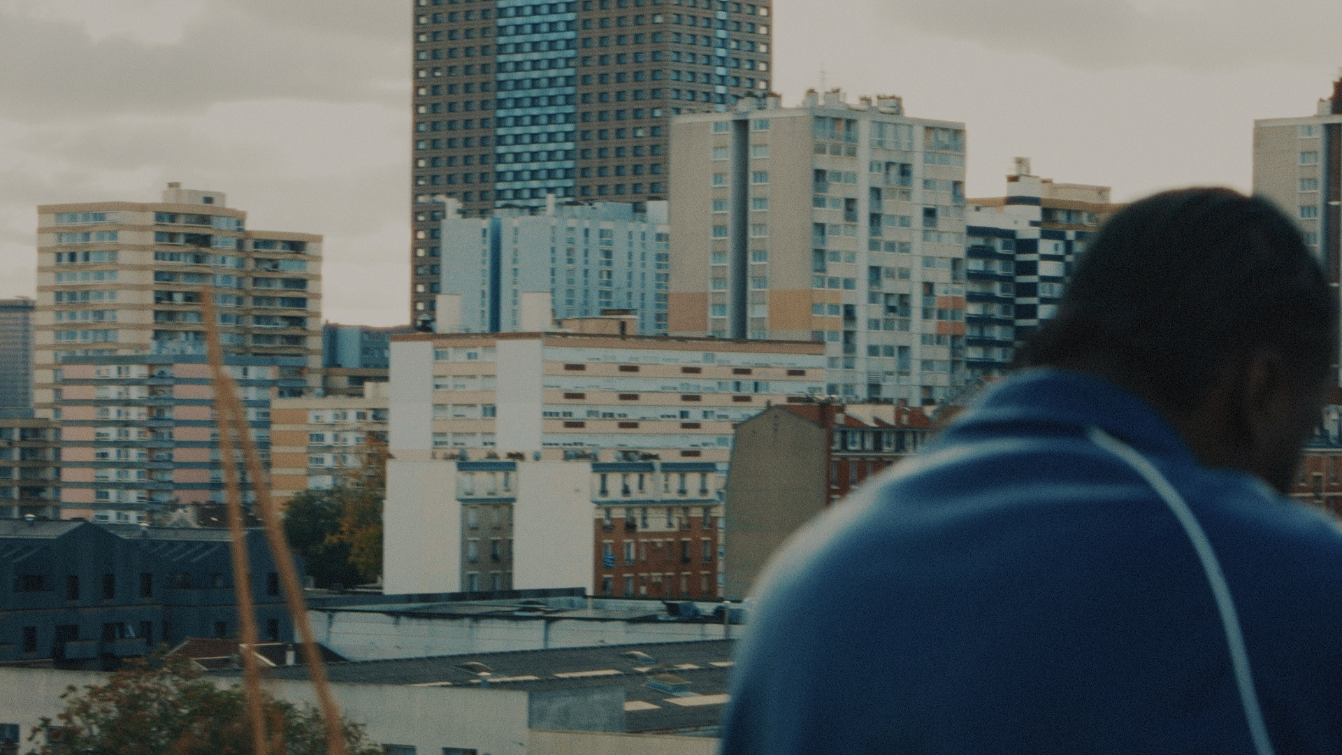 Artist against the tower blocks